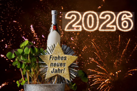 auf dem Bild ein Stern mit der Inschrift "Frohes neues Jahr"