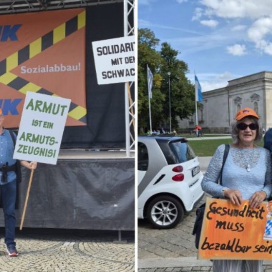 zwei Menschen mit Demo Schild